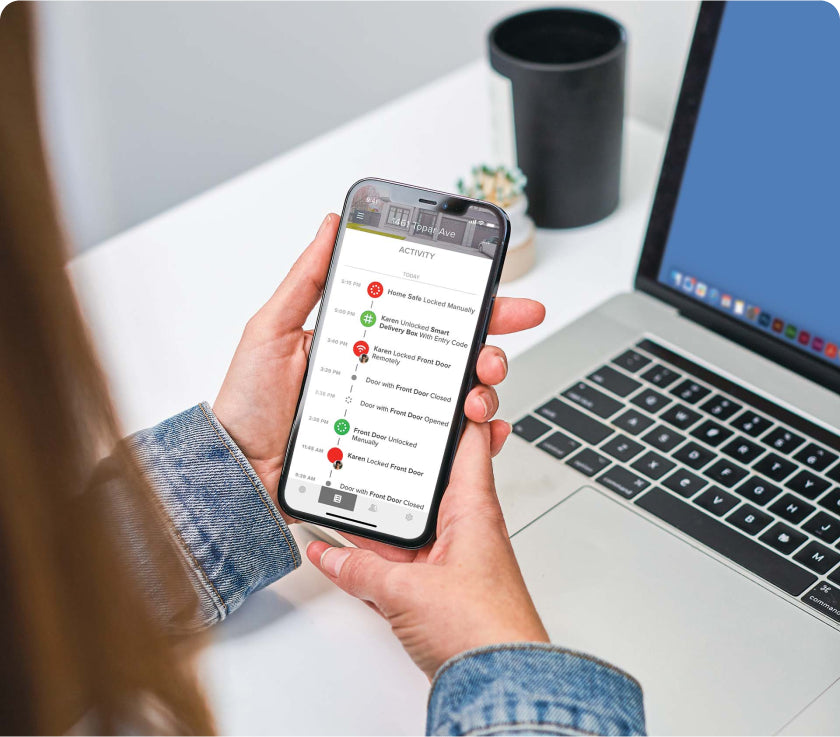 Woman checking her front door activity from her phone